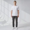 YR BW (4) Model wearing a plain white crewneck t-shirt, dark gray pants, and white sneakers