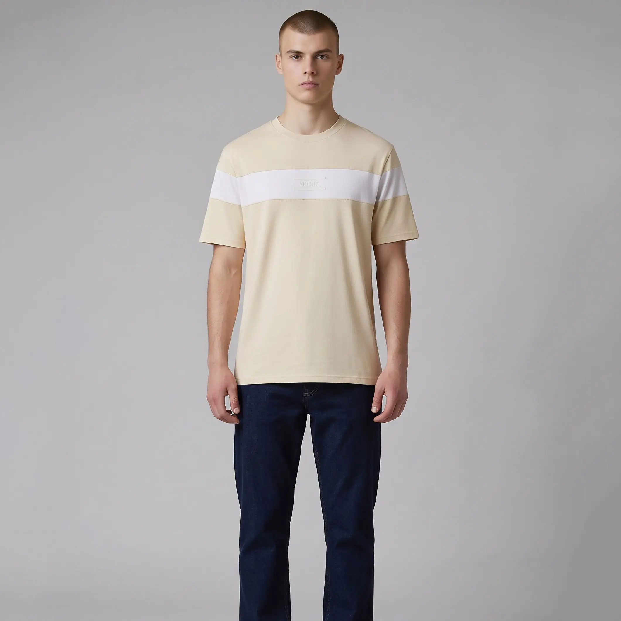 Model wearing a cream-colored t-shirt with a broad white stripe across the chest and dark blue jeans